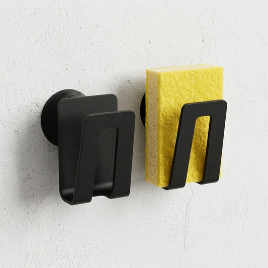 Happy Sinks Magnetic Sponge Holder in black bio-composite, side profile view against white background.