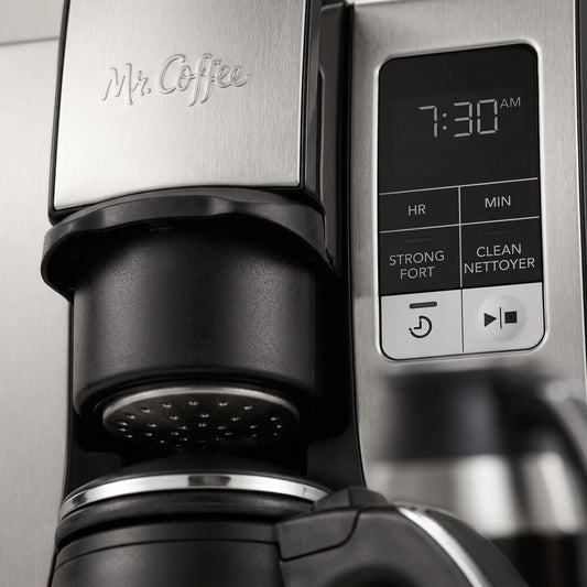 Macro detail of the Mr. Coffee 10-cup coffee maker's digital display, brew basket, and logo.