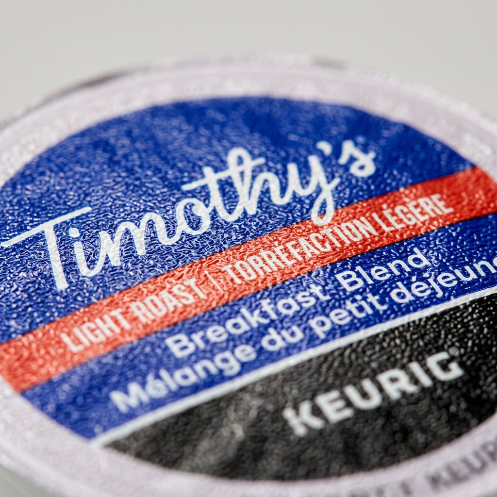 Timothy's Breakfast Blend K-Cup pod close-up showing logo and light roast label