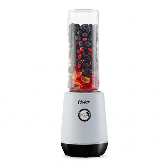 An elevated e-commerce hero shot of the Oster MyBlend Plus 2130839 personal blender, white motor base with 'Oster' logo and a single black-rimmed control button, featuring a 20 oz. Tritan sport bottle filled with blackberries, blueberries, pomegranate seeds, and peach slices against a seamless pure white background with a subtle, clean shadow underneath for scale, displaying realistic materials, precise product geometry, and a crisp, focused finish suitable for a premium product detail page.