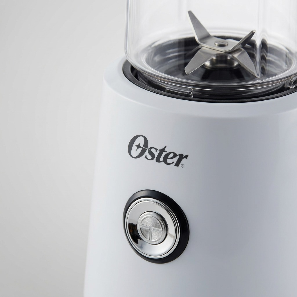 Macro view of the Oster 2130839 MyBlend Plus, showcasing the detailed metal blades and control area.