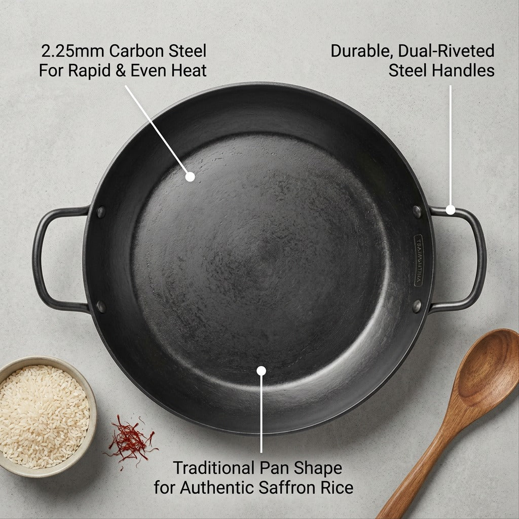 Top-down view of the 15-inch carbon steel paella pan, highlighting its durable steel handles, 2.25mm thickness for even heat, and traditional shape.