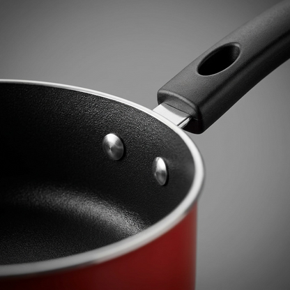 Tramontina 18-Piece Nonstick Cookware Set black nonstick surface red exterior close-up
