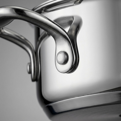 Tramontina Tri-Ply Base Stock Pot handle rivet and seam close-up

