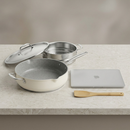 Tramontina All-In-One Plus Pan 5 Qt Sea Salt size reference with laptop

