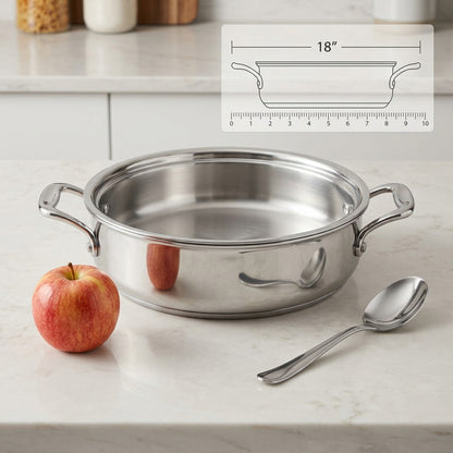 Tramontina Signature 3 Qt Braiser shown beside an apple and spoon for size reference.
