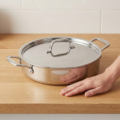 Tramontina Signature 6 Qt Braiser shown on a wooden counter for size reference.
