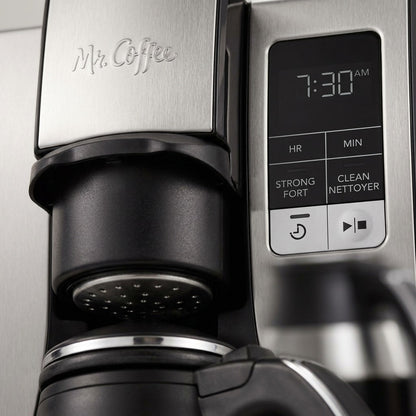 Macro detail of the Mr. Coffee 10-cup coffee maker's digital display, brew basket, and logo.