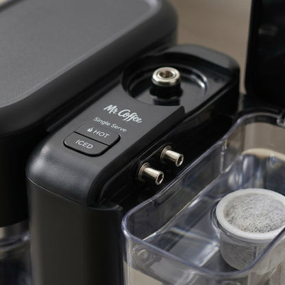 Macro view of Mr. Coffee 4-in-1 control panel with Hot and Iced buttons and milk frother connector.
