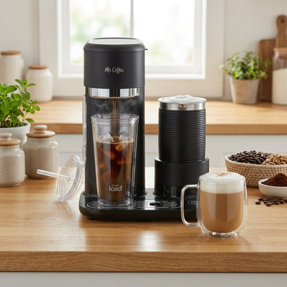 Mr. Coffee 4-in-1 coffee maker brewing iced coffee next to a milk frother and a finished latte.