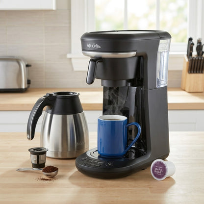 Mr. Coffee 10-Cup + Pod combo brewer on a kitchen counter, featuring a thermal carafe and blue mug.
