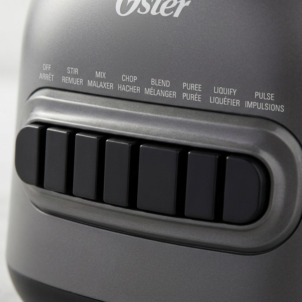 Macro detail of the Oster 8-Speed Blender control panel featuring black push buttons and bilingual labels.