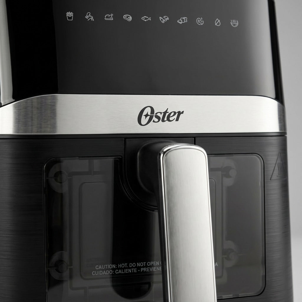 Macro detail of Oster 4-Quart Air Fryer showing digital presets, steel trim, and viewing window.