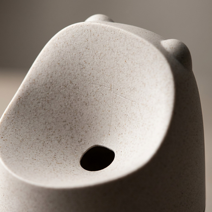 Macro view of the HAPPY SiNKS KONNA Fruit Fly Trap funnel in textured nature white wood biocomposite.