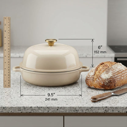 Scale of Tramontina 9.5 inch latte bread oven shown on counter with loaf of sourdough and ruler.
