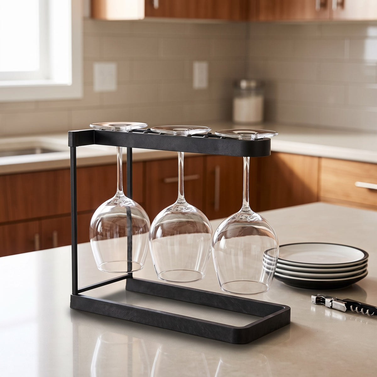 Happy Sinks Wine Glass Rack in charcoal holding three wine glasses on a kitchen counter